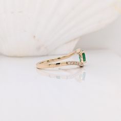 This beautiful classic ring features a Zambian emerald in solid 14k yellow gold. A fancy ring design perfect for an eye-catching engagement or anniversary. This ring also makes a beautiful birthstone ring for your loved ones. This ring is made with solid 14K Gold and naturally Earth-mined SI / G-H diamonds. As listed, this ring is ready to ship. If you're interested in purchasing this setting with a different center stone please message us! 14k Gold Emerald Cut Birthstone Promise Ring, 14k Yellow Gold Emerald Ring For Promise, Classic Emerald Ring For Promise, 14k Yellow Gold Emerald Ring With Tension Setting, 14k Gold Emerald Promise Ring, May Birthstone, Promise Emerald Ring In Yellow Gold, 14k Gold Emerald Ring For Promise, May Birthstone, 14k Gold Solitaire Emerald Promise Ring, Elegant Emerald Ring With Tension Setting For May Birthstone