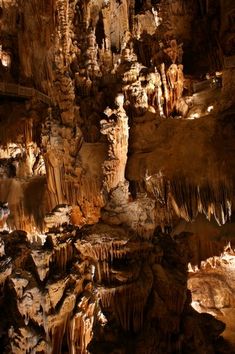 the inside of a cave with stalate formations