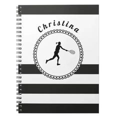 a black and white spiral notebook with a woman tennis player on it's cover