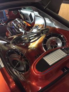 the interior of a car with speakers and other items in it's dash board