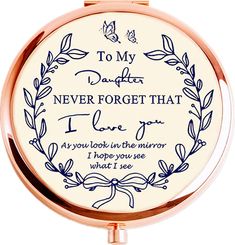 a compact mirror with an inscription on it that says, to my daughter never forget that i love you