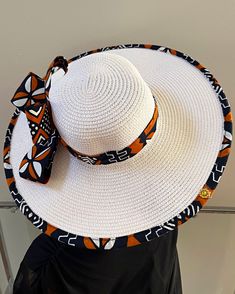 ombines timeless elegance with vibrant cultural flair. Handcrafted with care, this hat features a beautifully woven straw base adorned with bold African print fabric, offering both style and sun protection. Perfect for church services, outdoor events, or simply adding a touch of sophistication to your outfit, this hat blends tradition with modern design. Lightweight and breathable, it's as comfortable as it is striking. Elevate your look with a hat that celebrates heritage and craftsmanship. One size: should fit all. **** The straw hat color might vary from white to Beige. Elegant White Straw Hat, White Elegant Straw Hat, White Straw Hat With Curved Brim, White Fedora Straw Hat For Vacation, White Toquilla Straw Hat For Summer, White Flat Brim Straw Sun Hat, White Straw Sun Hat With Flat Brim, White Toquilla Straw Boater Hat For Summer, White Summer Panama Hat For Kentucky Derby