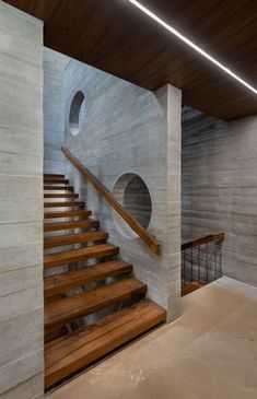 the stairs are made of concrete and wood