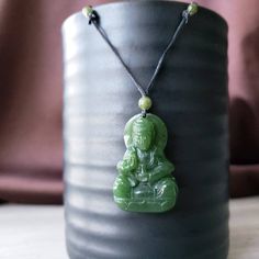 Jade Goddess of Love, Compassionand Mercy. Hand-carved Nephrite jade from British Columbia. Comes with a waxed cord necklace with genuine jade beads. Option to purchase a heavy figaro chain with heavy bail. Kwan Yin or Guan Yin is the Chinese Buddhist Goddess of Love, Compassionand Mercy. She is revered in the Eastern Asian cultures as she bring peace and serenity. measurements: 35mmx20mm6mm weight: 8 grams Buddhist Goddess, Female Buddha, Necklace Guide, Jade Buddha, Guan Yin, Buddha Necklace, Kwan Yin, Buddha Pendant, Goddess Of Love