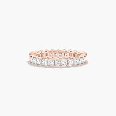 a rose gold ring with princess cut diamonds