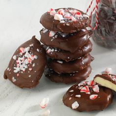 a stack of chocolate covered cookies next to a bag of peppermint patties