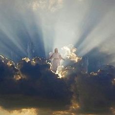 an image of jesus in the clouds with sun rays coming through it's center