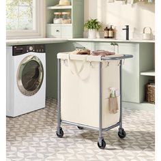 a laundry room with a washer and dryer on wheels in front of a window