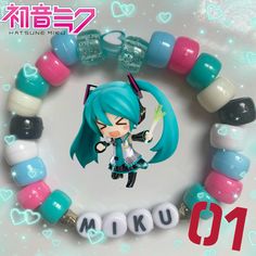 a bracelet with an anime character on it and the word miko written in japanese