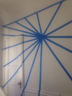 a room with blue lines painted on the wall