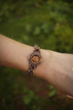 handmade macrame bracelet with tiger eye - - - * MATERIALS: - waxed Linhasita polyester thread 1 mm - Brass beads - Cabochons ↠ All of my jewelry is made from high quality materials. However, to ensure maximum longevity, I recommend avoiding regular contact with water. * CLOSURE adjustable (sliding clasp) Adjustable Holistic Brown Jewelry, Handmade Brown Spiritual Braided Bracelets, Spiritual Brown Handmade Braided Bracelet, Spiritual Brown Macrame Braided Bracelets, Earthy Brown Macrame Jewelry, Bohemian Macrame Agate Jewelry, Brown Macrame Nature-inspired Jewelry, Macrame Gemstone Bracelet, Spiritual Agate Macrame Jewelry