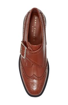 Brogue perforations and wingtip styling add timeless elements to a lofty platform loafer fashioned with an adjustable monk strap for a secure fit. 1 1/2" heel; 1" platform Adjustable monk strap with buckle closure Leather upper/synthetic lining and sole Imported Fall Office Wingtip Platform Loafers, Brown Wingtip Platform Loafers With Brogue Detailing, Brown Wingtip Brogue Platform Loafers, Formal Wingtip Platform Loafers With Brogue Detailing, Fall Wingtip Loafers With Brogue Detailing, Fall Wingtip Platform Loafers For Work, Fall Business Wingtip Platform Loafers, Fall Monk Strap Shoes With Brogue Detailing, Fall Monk Strap Shoes With Brogue Detailing And Wingtip