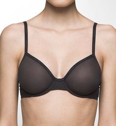 Sexy, see-through, sophisticated bra has seamless micromesh underwire cups that support with soft fabrics for comfortable wear. Made of nylon and elastane. Sheer, unpadded, stretchy molded cups give each breast a customized individual fit. Calvin Klein elastic is sewn on at neckline for fit. Bandless front offers less bulk for short-waisted women. Center - two-ply triangle panel. Sides and back are micromesh with sewn-on elastic at top and bottom edges. Wide-set front straps are non-stretch fabr Fitted Seamless Calvin Klein Bra, Calvin Klein Fitted Seamless Bra, Calvin Klein Seamless Fitted Bra, Calvin Klein Seamless Bra, Elegant Black Nylon Bra, Elegant Calvin Klein Bra With Built-in Support, Elegant Calvin Klein Underwire Bra, Calvin Klein Elegant Underwire Bra, Fitted Elegant Calvin Klein Bra