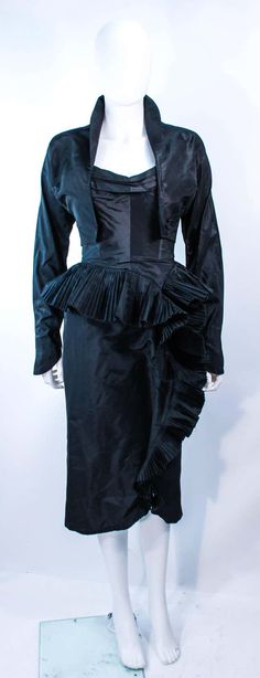 For Sale on 1stDibs - This Irene ensemble is composed of black silk. The strapless cocktail dress features a pleated bust with side draped, cascading ruffle, with interior boning. 1950s Outfits, Cocktail Gowns, Black Silk, Ruffles, Timeless Fashion, Victorian Dress, Evening Dresses, Cocktail Dress, Silk