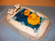 there is a cake with a rubber duck in the water