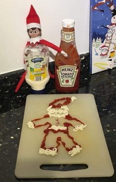 an elf is standing next to a cutting board with ketchup and mayonnaise