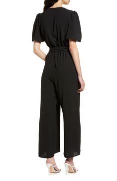 An updated alternative to classic officewear, this sleek jumpsuit features a flattering surplice neck and waist sash for an extra touch of elegance. 56" length Front button closure Surplice V-neck Short sleeves Removable tie belt Partially lined 100% polyester Hand wash, line dry Made in the USA of imported fabric Women's Clothing Belted Jumpsuit Or Romper For Date Night, Belted Jumpsuits And Rompers For Date Night, Solid Belted Jumpsuit For Date Night, Belted Jumpsuit For Date Night, Sleek V-neck Jumpsuits And Rompers For Work, Sleek Formal Jumpsuits And Rompers With V-neck, Elegant Belted Jumpsuit For Date Night, Sleek Formal V-neck Jumpsuits And Rompers, Elegant Belted Solid Jumpsuits And Rompers