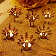 there are many small candles in the shape of trees