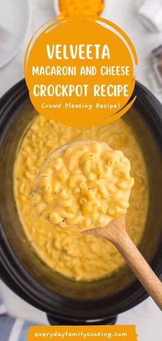 a spoon full of macaroni and cheese crockpot recipe