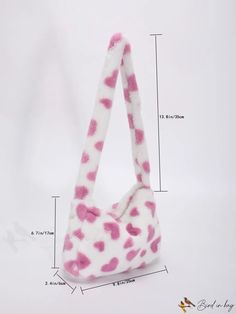 a pink and white bag with hearts on it's side, measurements are shown