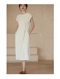 A dress with a unique silhouette that has buttons at the waist and the fabric is gathered together. The design looks like the sleeves are rolled up and folded back. A casual item that can be worn on vacation. 
 
 
 
 
 
 
 
 
 
 
 
 
 
 
 
 Size 
 
 
 S size 
 
 
 Length: 105.5cm 
 Bust: 104cm 
 Sleeve length: 16cm 
 
 M size 
 
 Length: 107cm 
 Bust: 108cm 
 Sleeve length: 16.5cm 
 
 L size 
 
 Length: 108.5cm 
 Bust: 112cm 
 Sleeve length: 17cm 
 
 XL size 
 
 Length: 110cm 
 Bust: 116cm 
 Sle Summer Dresses With Pleated Sleeves In Relaxed Fit, Summer Dresses With Pleated Sleeves And Relaxed Fit, Casual Midi Dress With Pleated Sleeves For Daywear, Casual Midi Dress With Pleated Sleeves, Relaxed Fit Dress With Pleated Sleeves For Daywear, Midi Dress With Pleated Waist For Day Out, Beach Midi Dress With Pleated Waist, Chic Shift Midi Dress With Pockets, Beige Summer Dress With Pleated Sleeves