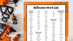 a halloween word list on a table with decorations