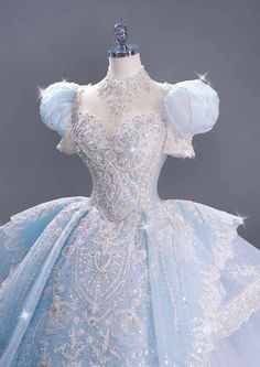 a blue and white ball gown on display