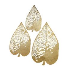 three gold leaf shaped metal pieces on a white background