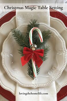 a white plate topped with candy canes and a christmas decoration on top of it