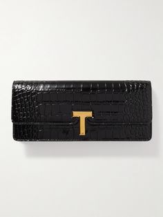 TOM FORD's clutch is made from glossy croc-effect leather in classic black that will work with all kinds of outfits. It has a slim shape that fits comfortably in your hand and opens to a compact interior with space for your cards, keys and lip gloss. Flat Dress Shoes, Of Outfits, Boot Pumps, Leather Clutch, Embossed Leather, Tom Ford, Fashion Bracelets, Fashion Watches, Evening Bags