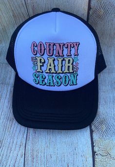 --- **Title black Trucker Hat - "County Fair Season" - Perfect for fair fun! **Description Celebrate the spirit of the county fair with our black trucker hat, featuring the lively slogan "County Fair Season"on the front. This hat combines comfort and style with its breathable mesh back, adjustable snapback closure, and bold hot pink color. Whether you're browsing the stalls, enjoying rides, or indulging in fair treats, this hat is your go-to accessory for all the  fair fun!   - Mesh Back: 100% P Summer Trucker Hat For Country Events, Festival Trucker Baseball Cap With Curved Brim, Festival Trucker Cap With Curved Brim, Festival Trucker Baseball Cap, Black Snapback Hat For Summer Festival, Trucker Baseball Cap For Festival, Summer Festival Trucker Snapback Hat, Country Style Summer Baseball Cap, Summer Country Style Baseball Cap