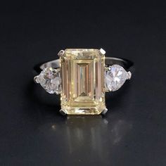 Personally Designed Yellow Citrine Art Deco ring in sterling silver. This classically designed ring is made with beautifully citrine with Emerald cut. Solid and thick band with a professional finish. You will not be disappointed with this beautiful ring.  💎 Gem Stone: Lab treated yellow citrine with emerald cut. 💎Main gemstone size: 12*8mm 💎 Side Stone: Clear Topaz 💎 Gemstone Shape: Rectangular  💎 Material: Sterling Silver with 3 times 18k white gold plating 💎 Band Size - please message us Yellow Emerald Cut Ring, Emerald Cut Yellow Rings For Wedding, Yellow Emerald-cut Wedding Rings, Yellow Topaz Ring With Center Stone In Sterling Silver, White Gold Citrine Jewelry With Center Stone, Classic Yellow Citrine Birthstone Ring, Emerald Cut Yellow Topaz Ring For Wedding, Anniversary Yellow Citrine Topaz Ring, Anniversary Yellow Topaz Citrine Ring