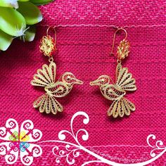 Beautiful and stunning handmade Mexican Filigree Earrings.  Each piece is meticulously created out of copper wire and spun into a beautiful design. To give it the final touch artisans dipped into gold plate for it's gold color.  This accessory is an important part of the traditional Tehuana outfit from Oaxaca, Mexico.  Look elegant while wearing Mexico's culture with this one of a kind earrings! Approximate length: 3.5 - 4 in Mexico Culture, Artisan Earrings, Filigree Earrings, Final Touch, Copper Wire, Favorite Jewelry, Jewelry Earrings Dangle, Beautiful Design, Gold Color