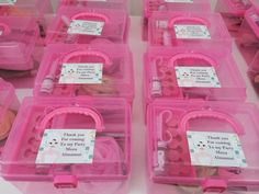 pink plastic containers filled with lots of different items