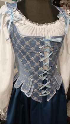 "the corset is sewn from brocade fabric reinforced with metal bones, lined. It has lacing on the front and back. The holes are from metal. size 8 - bust 31\"1/2, waist 24\", hip 33\"1/2 size 10 - bust 32\"1/2, waist 25\", hip 34\"1/2 size 12 - bust 34\", waist 26\"1/2, hip 36\" size 14 - bust 36\", waist 28\", hip 38\" size 16 - bust 38\", waist 30\", hip 40\" size 18 - bust 40\", waist 32\", hip 42\" size 20 - bust 42\", waist 34\", hip 44\" size 22 - bust 44\", waist 37\", hip 46\" size 8 - bu Fitted Corset With Boning For Costume, Fitted Bodice Corset With Boning For Costume, Victorian Overbust Corset Dress With Boned Bodice, Victorian Corset With Historical Design, Fitted Overbust Corset Dress For Costume, Underbust Boned Bodice For Costume Party, Victorian Fitted Corset For Costume, Victorian Style Corset With Fitted Bodice, Underbust Corset Dress With Boning And Fitted Bodice