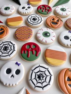 many decorated cookies are arranged on a table