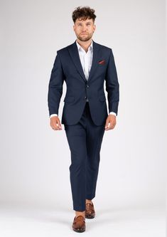 The Bryant Navy Sharkskin Suit is the perfect choice for any smart occasion. Crafted with a luxurious navy sharkskin fabric and custom made for a premium appearance, it has a deep blue color, a stylish and modern cut, and will make you look and feel confident. Navy Fitted Double Breasted Suit With Notch Lapel, Navy Double-breasted Suit With Notch Lapel, Luxury Fitted Navy Tuxedo, Luxury Fitted Navy Blazer, Navy Fitted Tuxedo, Navy Fitted Tuxedo In Suiting Fabric, Navy Fitted Suits With Suit Collar, Navy Fitted Tuxedo For Workwear, Navy Tailored Suits For Formal Occasions