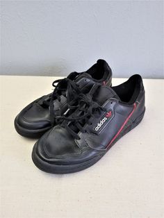 "Black with red and white elements leather lace up women Adidas sneakers. Sport flat shoes. Textile lining inside. Size EU 37. Made in Indonesia. labeled size: EU 37 1/2 / UK 4 1/2 / US 5 / JP 235. Estimated size is EU 37, US 6. condition: normal, used condition. Open a little bit right foot shoe frontal seam, but not practical meaning. measurements: sole heel height 2,5 cm / 0.98\" in outsole length 26 cm / 10.1\" in #s1103" Sporty Lace-up Skate Shoes With Red Sole, Sporty Skate Shoes With Red Sole And Lace-up, Adidas Logo Leather Lace-up Custom Sneakers, Custom Adidas Logo Leather Lace-up Sneakers, Casual Adidas Logo Custom Lace-up Sneakers, Leather Low-top Skate Shoes With Red Sole, Custom Black Sneakers With Elastic Laces And Round Toe, Sporty Leather Skate Shoes With Elastic Laces, Leather Lace-up Skate Shoes With Red Sole