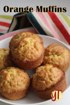 orange muffins on a white plate with the title above it that reads, orange muffins