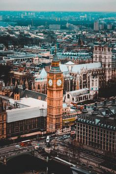 the big ben clock tower towering over the city of london, england as seen from above