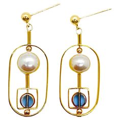 The earrings are lightweight and are made to rotate and reposition with movement. Small blue circle vintage German glass beads edged with 24K gold are complimented with freshwater pearls. The earrings are finished with gold-filled earring posts and gold-filled beads. The vintage German glass beads that are edged with 24K gold were hand-pressed during the 1920s- 1960s. No two beads are exactly alike. These beads are no longer in production thus making them rare and highly collectible. Product Det Handmade Modern Gold Pearl Earrings, Handmade Gold Modern Pearl Earrings, Beads Art, Blue Circle, Earring Posts, Bead Art, Vintage Stil, Post Earrings, Fresh Water