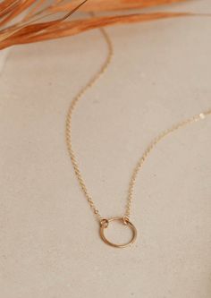 We love jewelry we can live in, like this Full Circle Necklace. Wear it alone or layered with your favorite delicate choker. Circle measures just over 1/2" wide. Offered in 16" or 18" lengths. Available in 14kt Gold Fill + Sterling Silver. Handmade in Eau Claire, WI. Our jewelry is handmade so each piece will be unique and may vary slightly from what is pictured. Delicate Open Circle Necklace For Gift, Delicate Chain Open Circle Necklace Gift, Dainty Personalized Circle Necklace, Delicate Yellow Gold Open Circle Necklace, Everyday Rose Gold Circle Necklace, Delicate Choker, Love Jewelry, Circle Necklace, Full Circle