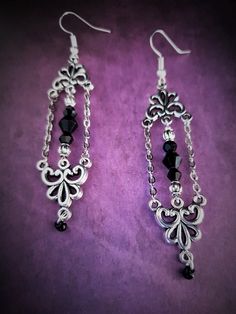 Introducing our exquisite pair of long and lightweight gothic Victorian style chandelier earrings with chain. Designed to make a statement, these earrings showcase a perfect blend of elegance and edginess. Crafted with care and attention to detail, these earrings feature intricate detailing that captures the essence of gothic and Victorian aesthetics. The elongated design gracefully dangles from your ears, creating a captivating effect that is sure to turn heads. Made from high-quality materials, these earrings are not only stunning but also comfortable to wear for extended periods. Take your style to new heights with these enchanting chandelier earrings, perfect for adding a touch of drama to any outfit. Each product is one of a kind so there might be slight variations in colour, thicknes Elegant Chain Chandelier Earrings As Gift, Elegant Metal Chandelier Earrings With Chain, Earrings With Chain, Gothic Vampire, Diy Jewelry Projects, Gothic Victorian, Statement Jewellery, Victorian Gothic, Chain Earrings