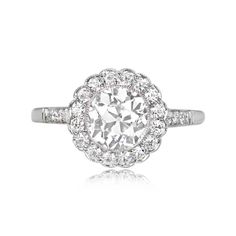 This diamond cluster ring features a 1.35 carat old European cut diamond, J color, and VS1 clarity, surrounded by a cluster of old European cut diamonds. Additional old European cut diamonds line the shoulders. This mounting is handcrafted in platinum, decorated with delicate milgrain and an openwork under-gallery.  The measurements of this ring, including the diamond halo, are approximately 10.97mm x 8.69mm.  This ring can be resized to any finger size at no extra cost.  Ready to Make It Yours? Contact us to reserve this ring and to get more info! Antique Cushion Cut Diamond, Antique Cushion Cut, Estate Diamond Jewelry, Cushion Cut Diamond Ring, Deco Ring, Cushion Cut Diamonds, European Cut Diamonds, Diamond Cluster Ring, Art Deco Ring