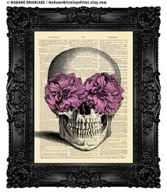 a skull wearing pink glasses on top of an old book page with ornate black frame