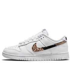 The Nike Dunk Low SE 'Primal White' offers a fresh take on the classic basketball sneaker. The upper is crafted from white leather and features a segmented Swoosh in three different finishes: suede leopard print, black snakeskin, and cracked metallic gold. Nike branding at the heel tab and tongue tag complete the look. A solid white rubber cupsole provides durability and traction, making this sneaker perfect for on or off the court. Nike Sneakers With Speckled Midsole For Streetwear, Low-top Basketball Shoes With Speckled Midsole For Streetwear, Nike Low-top Sneakers With Speckled Midsole, Nike Basketball Shoes With Speckled Midsole And White Sole, Sporty White Sneakers With Speckled Midsole, Classic Custom Sneakers With Speckled Midsole For Streetwear, Nike White Sneakers With Speckled Midsole, White Nike Sneakers With Speckled Midsole, Sporty White Basketball Shoes With Speckled Midsole