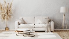 a living room with a white couch and coffee table