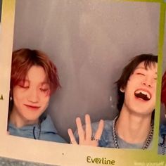 two people with their mouths open in front of a sign that says eveline on it