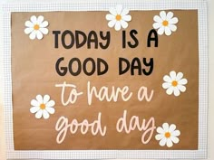 a brown paper bag with daisies and the words today is a good day to have a good day