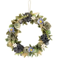 a wreath with succulents and flowers hanging from the front on a white background